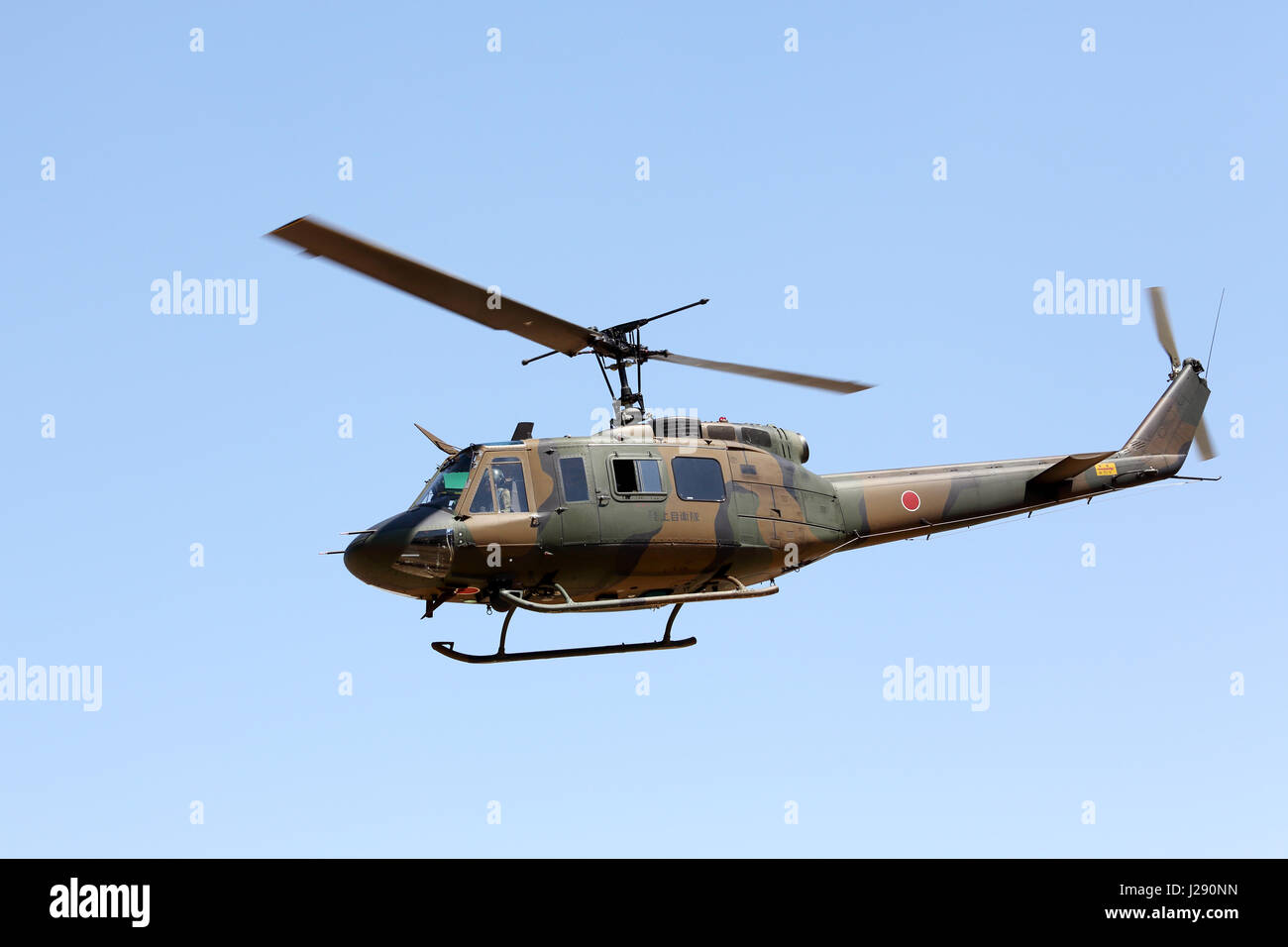 Japanese military helicopter in flight , Military helicopter flying Stock Photo