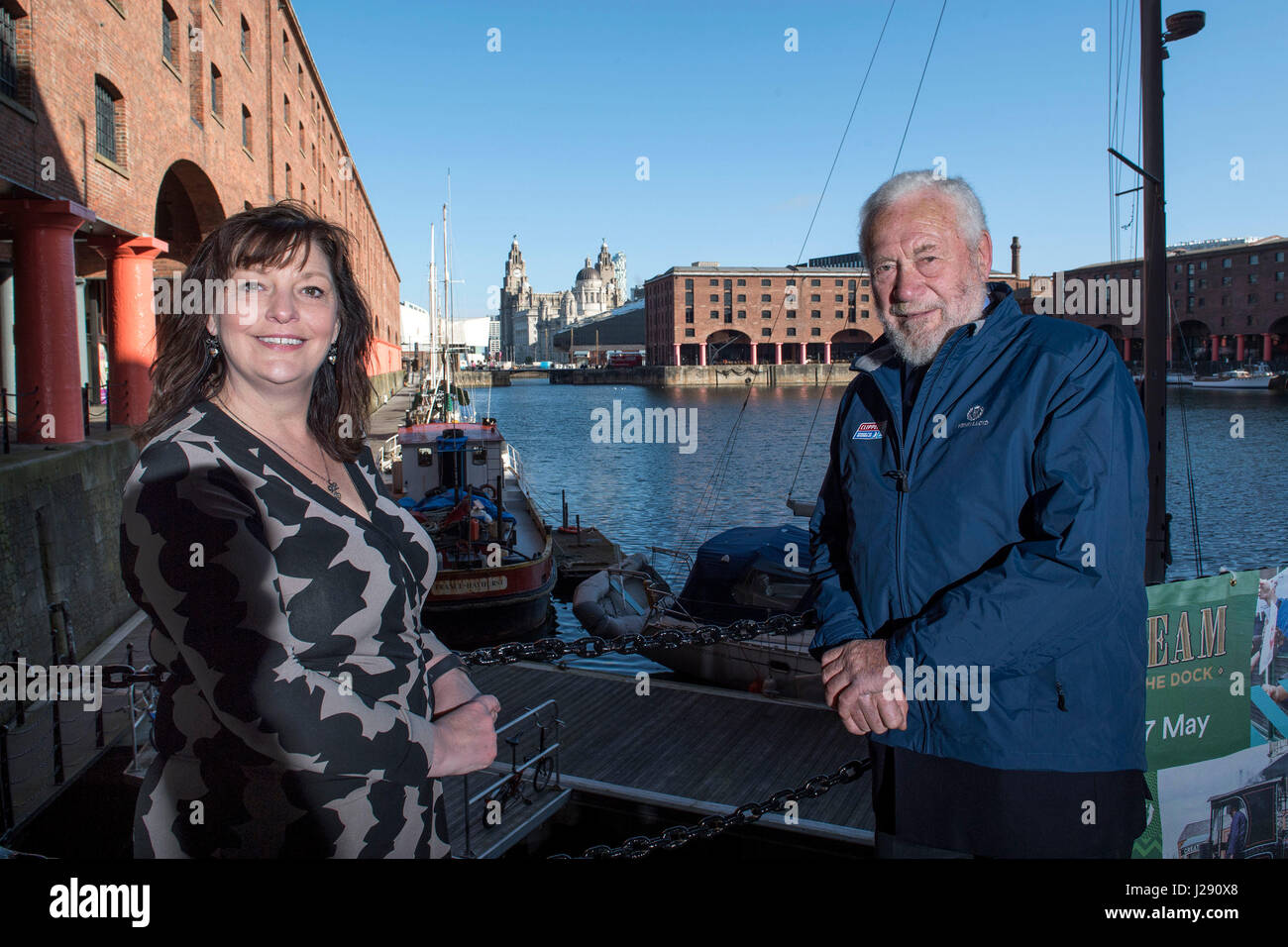 Sir Robin Knox-Johnston, founder of the Clipper Race, (right) and deputy Mayor of Liverpool Ann O'Byrne pose in Albert Dock as they announce the return of the Clipper Round The World Yacht Race to Liverpool. Stock Photo