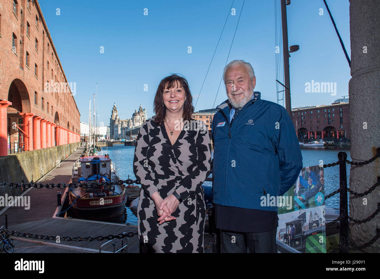 Sir Robin Knox-Johnston, founder of the Clipper Race, (right) and deputy Mayor of Liverpool Ann O'Byrne pose in Albert Dock as they announce the return of the Clipper Round The World Yacht Race to Liverpool. Stock Photo