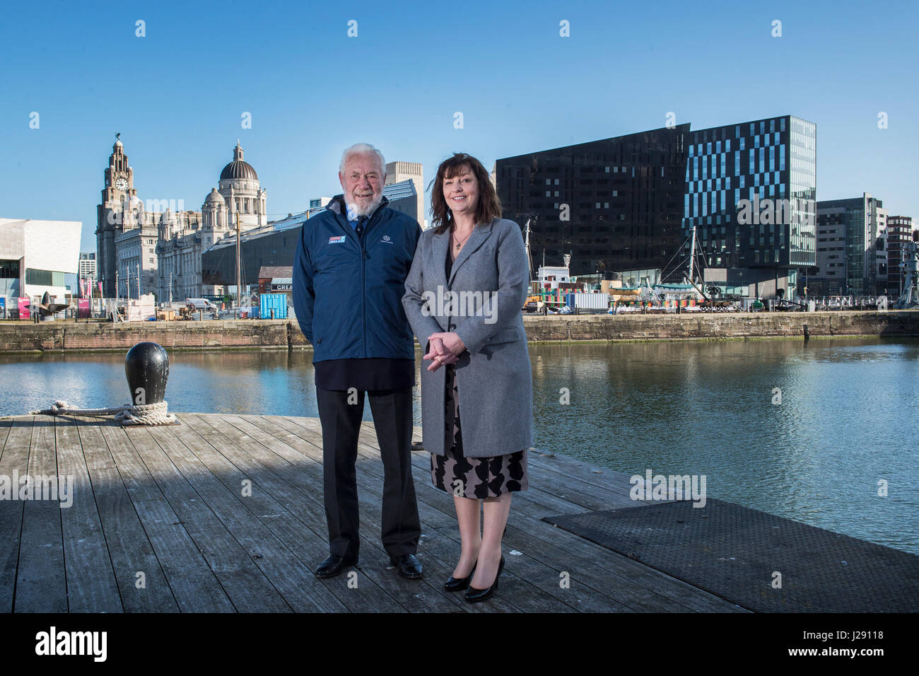 Sir Robin Knox-Johnston, founder of the Clipper Race, (left) and deputy Mayor of Liverpool Ann O'Byrne pose in Albert Dock as they announce the return of the Clipper Round The World Yacht Race to Liverpool. Stock Photo
