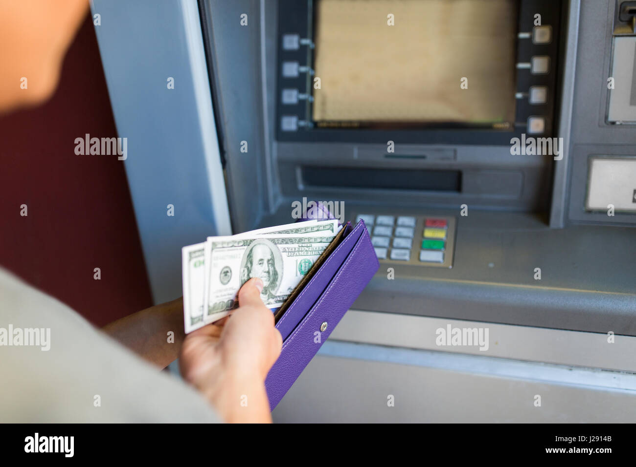 close up of hand withdrawing money at atm machine Stock Photo