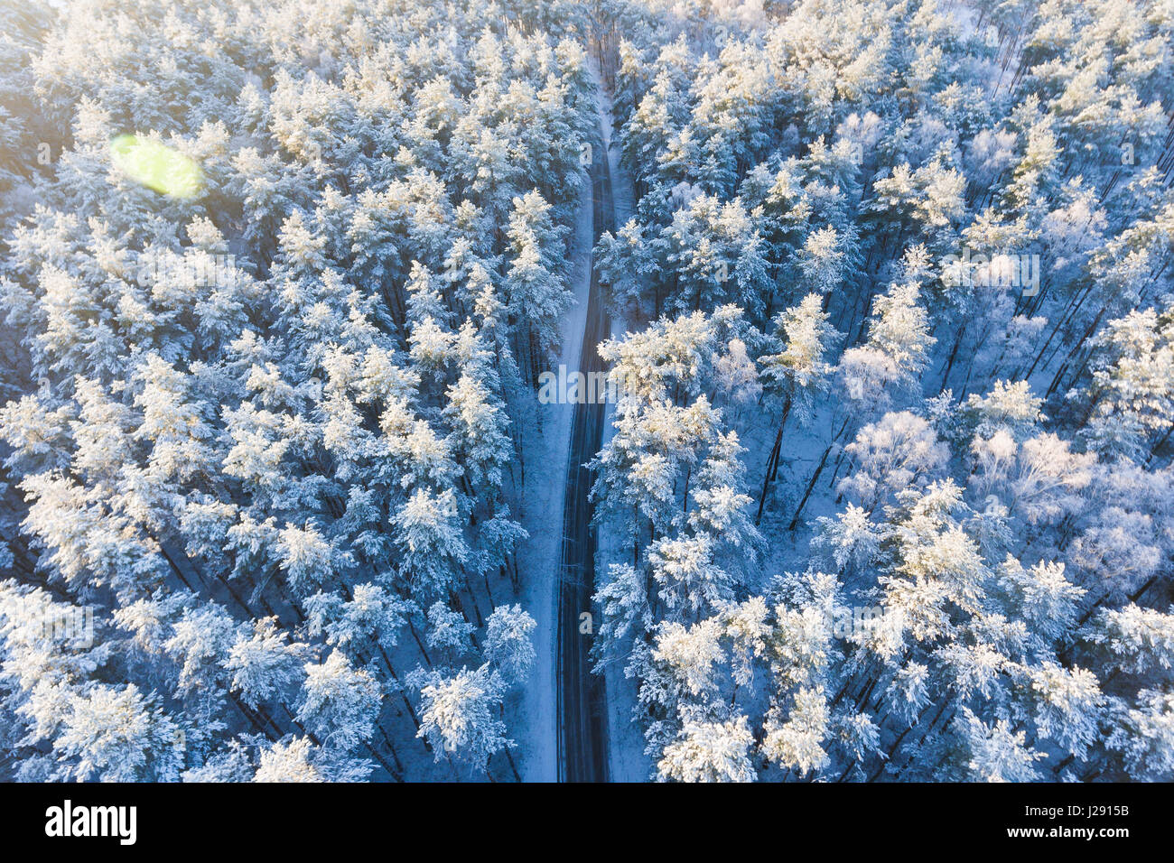 Road in a winter forest from above Stock Photo - Alamy