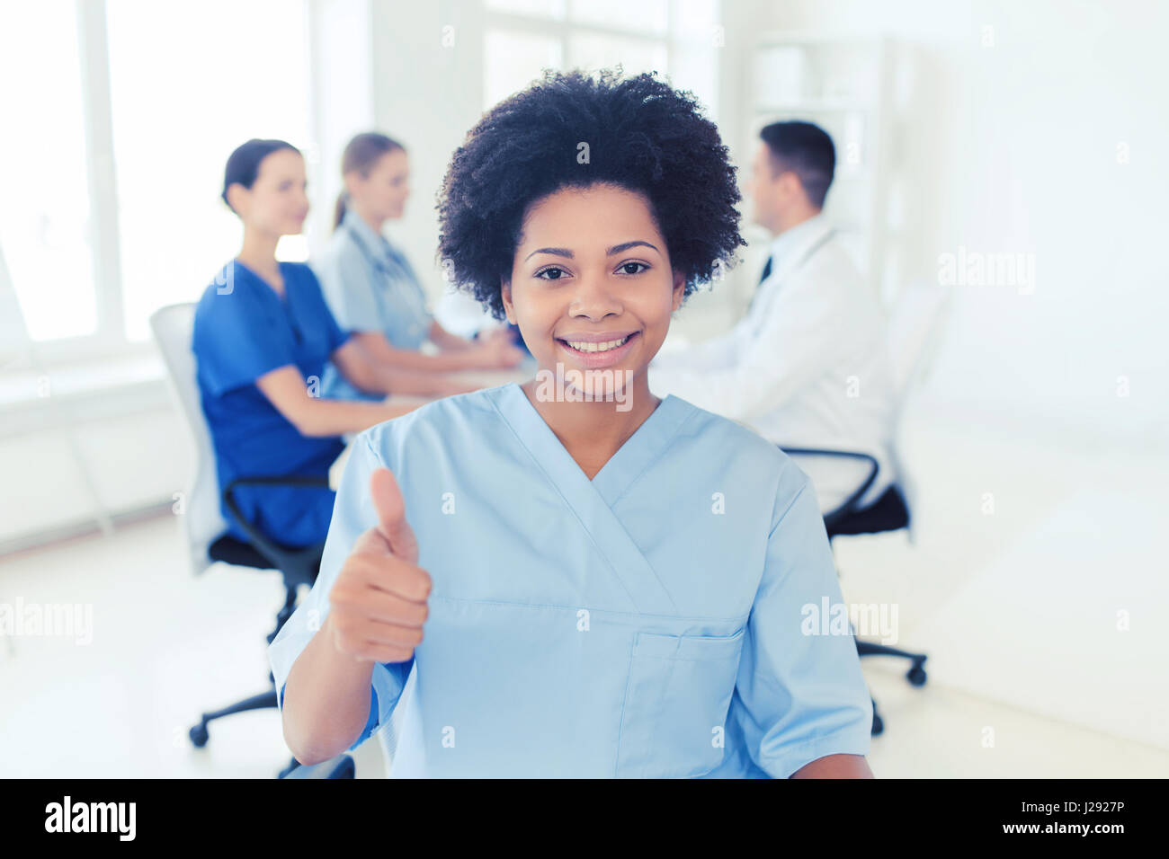 Thumbs up multiracial female doctor hi-res stock photography and images ...