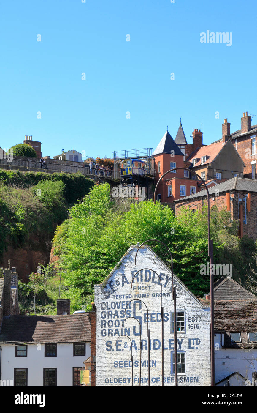 Old advertisement for S E & A Ridley seedsmen painted on the gable end of a building on Bridge Street and Cliff Railway above, Bridgnorth, Shropshire, Stock Photo