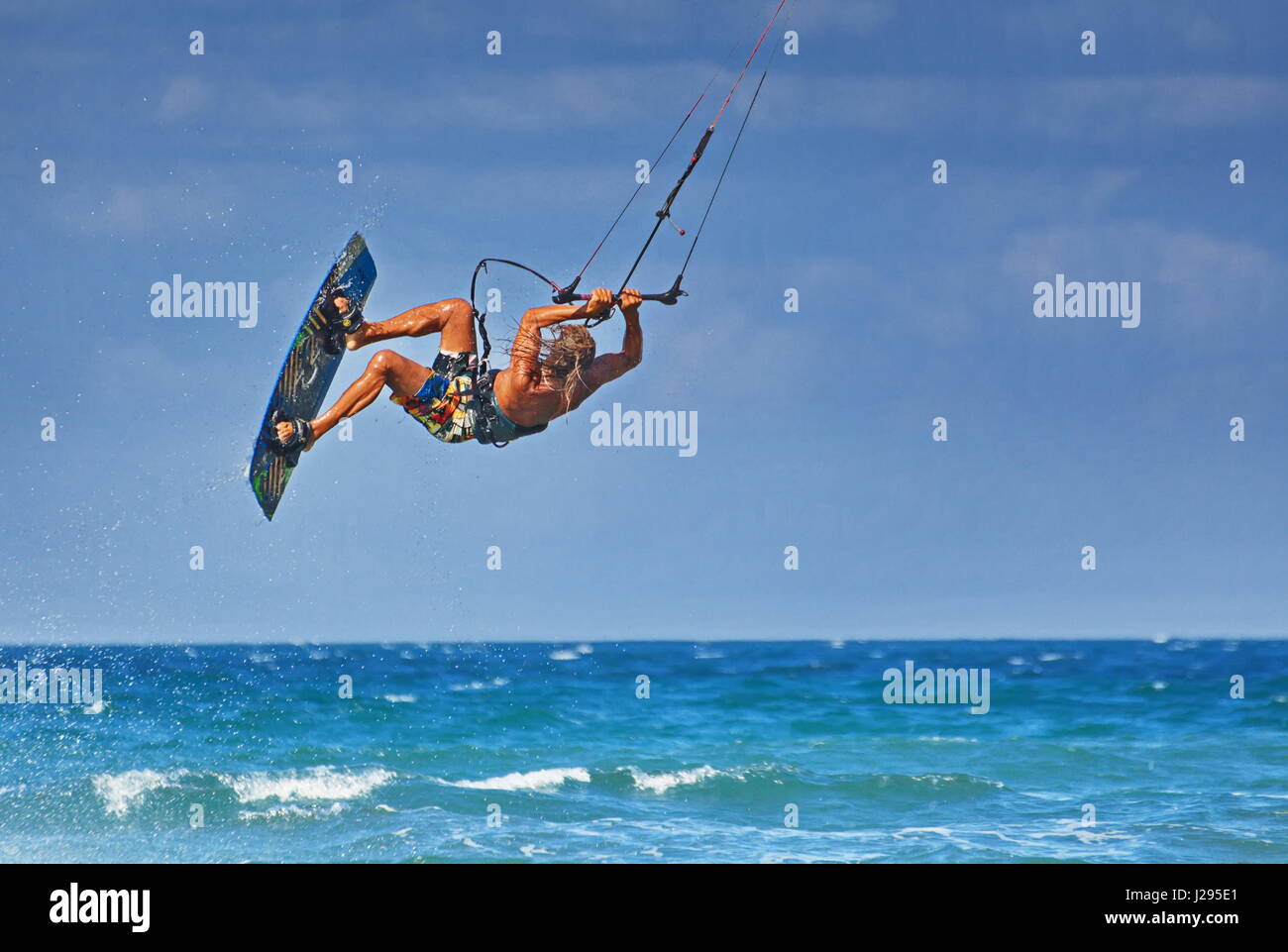 athlete kitesurfer man performing kite jumping tricks in the sea Stock Photo Alamy