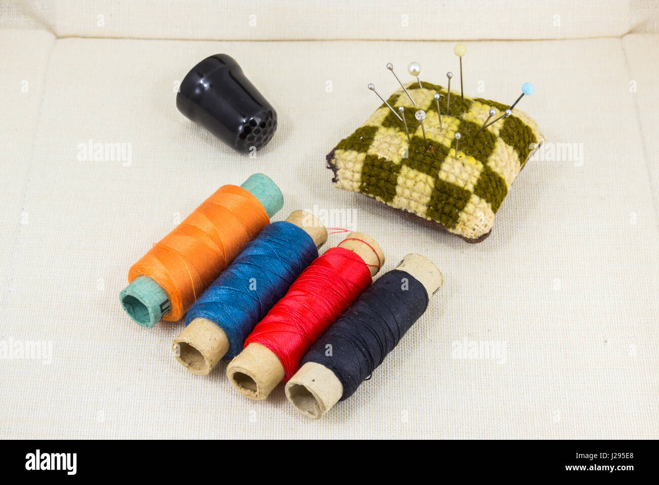 Beautifully laid out accessories for needlework on a fabric background Stock Photo
