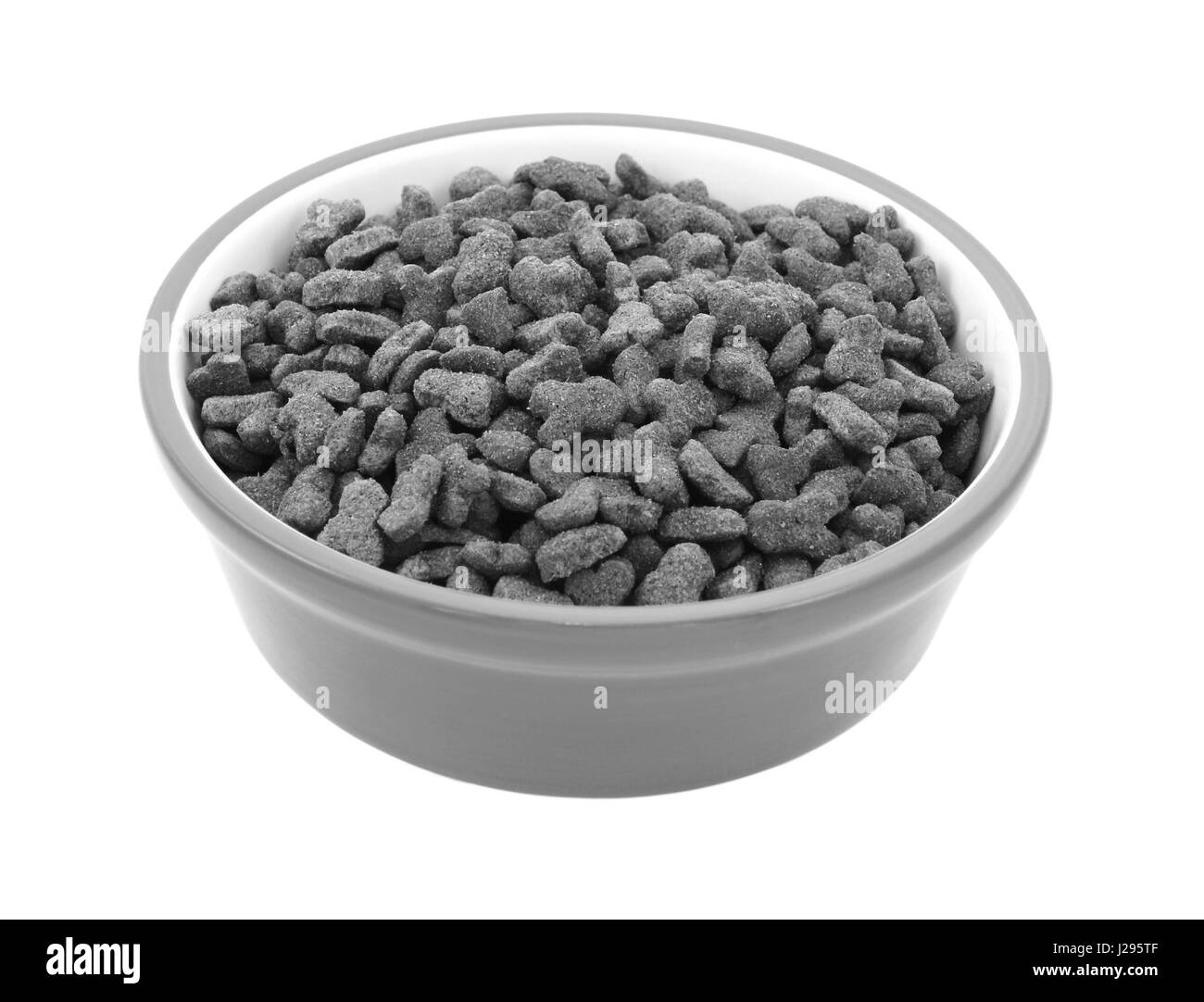 Dry cat biscuits in a pet food bowl, isolated on a white background ...