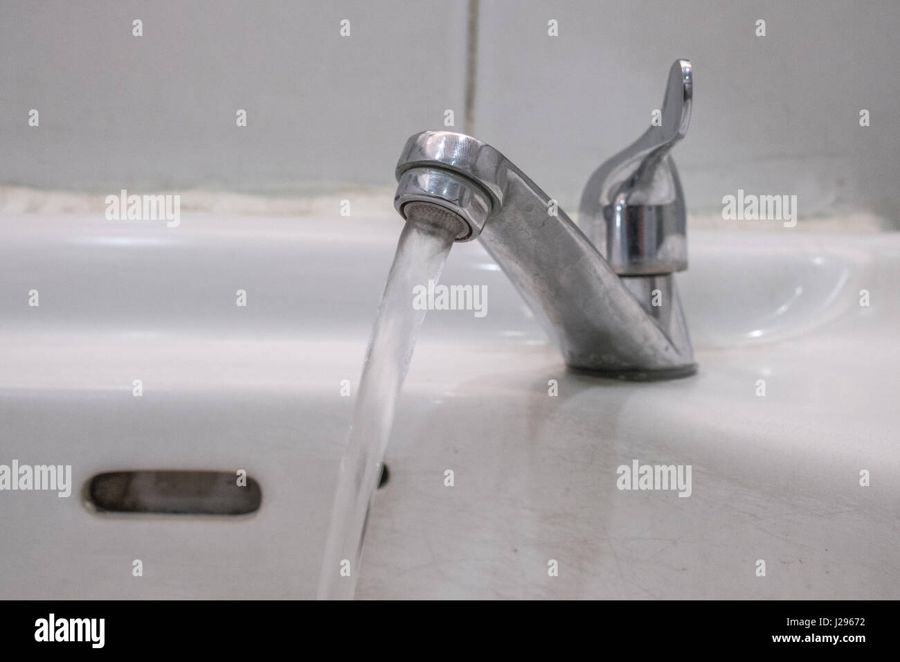 Water running from an open water faucet Stock Photo Alamy