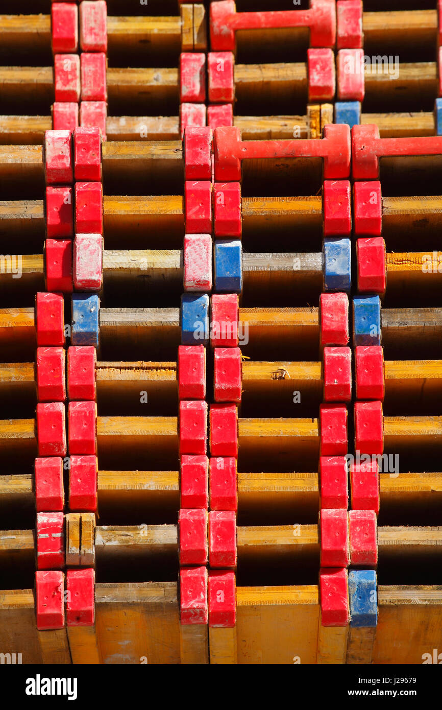 stacked up wooden bearer on a construction site Stock Photo