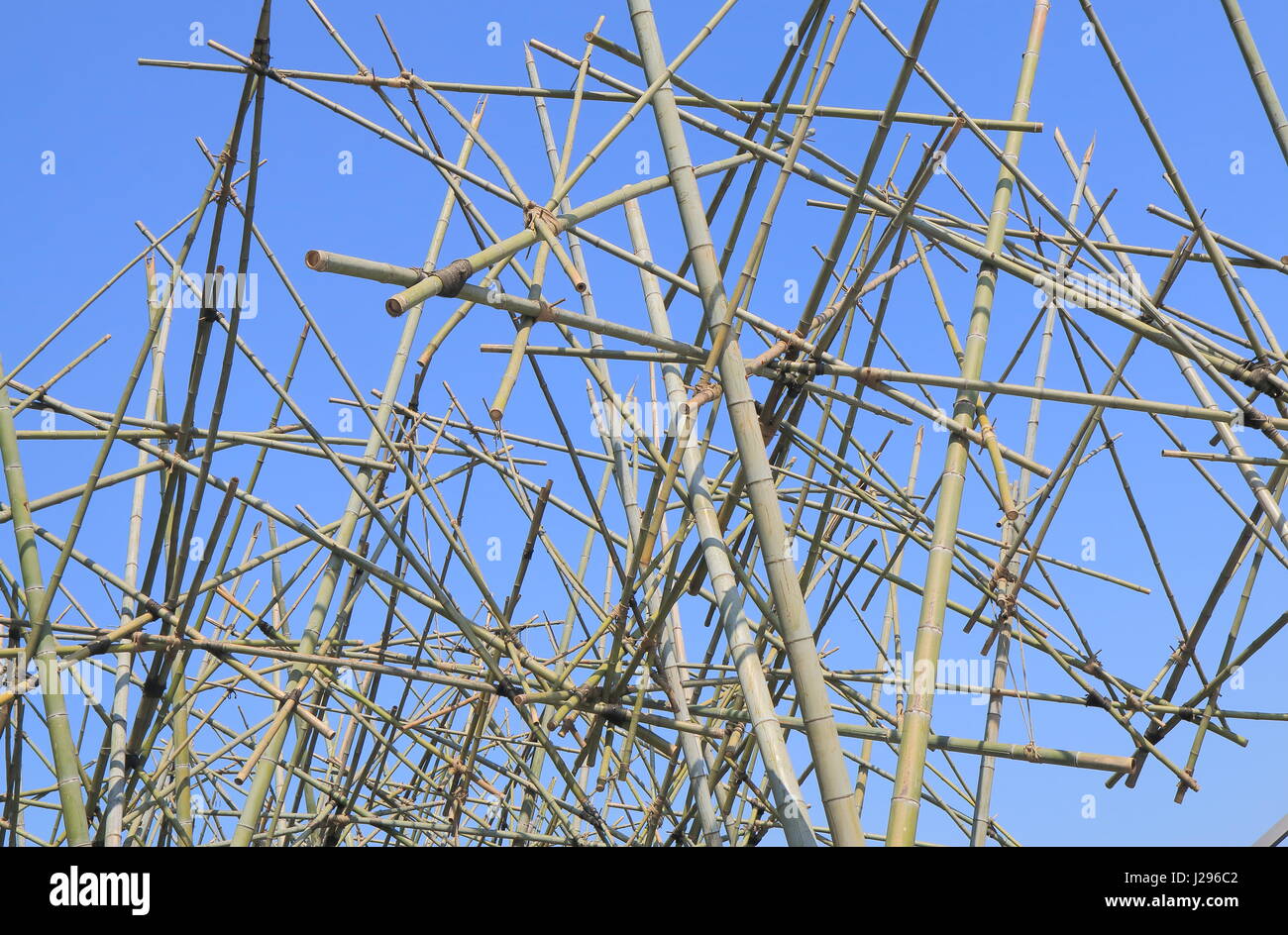 Bamboo scaffolding in blue sky Stock Photo