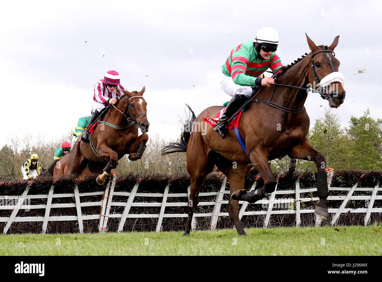 Magic Of Light (right) ridden by jockey Ryan Treacy jumps the last on ...