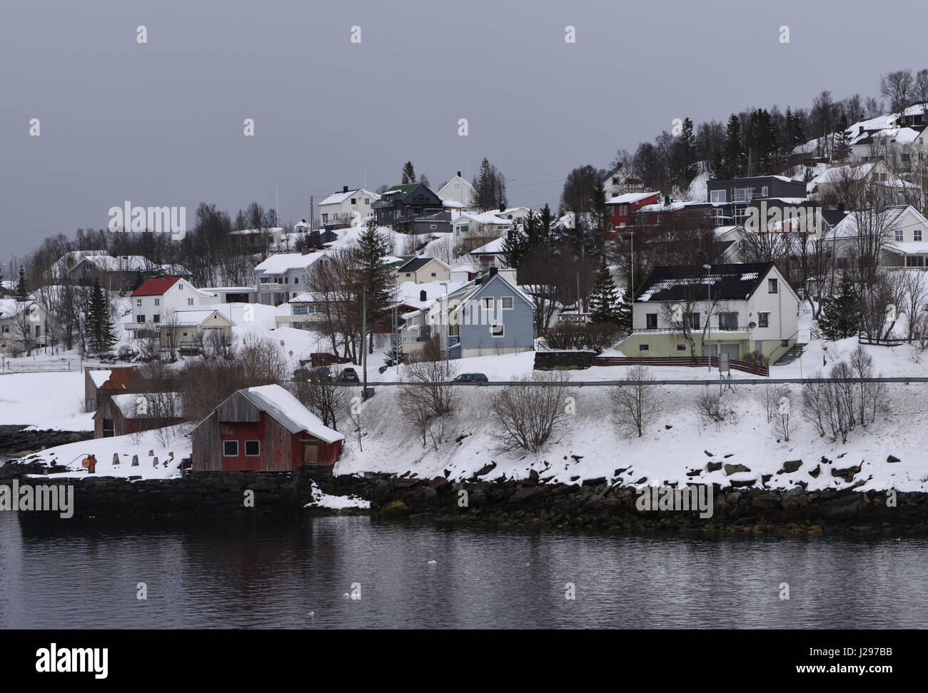 Houses on the coast in the town of Finnsnes.  Finnsnes, Lenvik, Troms, Norway. Stock Photo