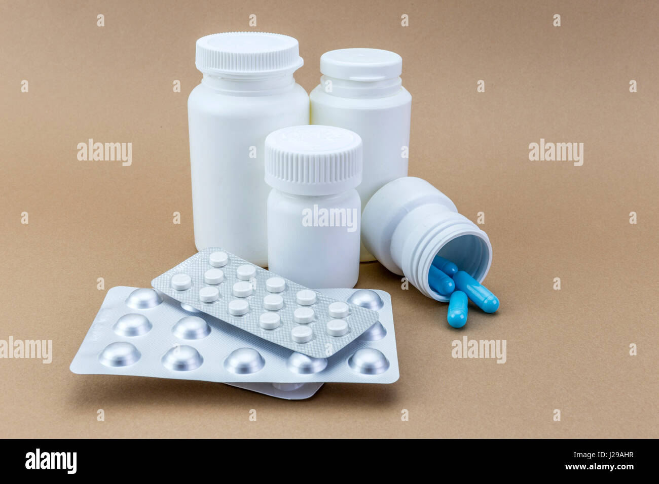 close up of medical pills isolated on brown background Stock Photo