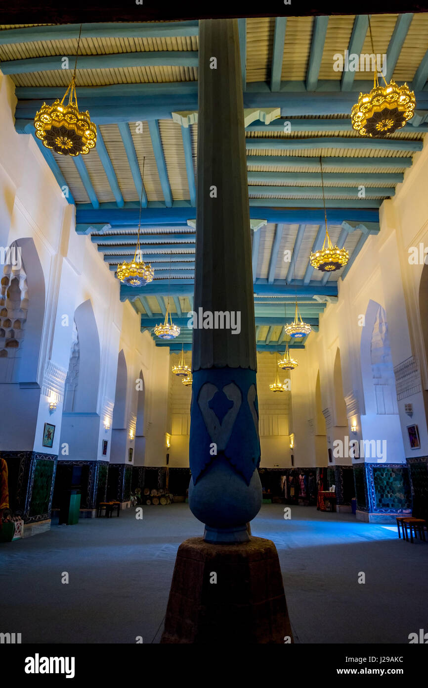 Interior with pillar and blue wooden ceiling of Registan madrasah, Samarkand, Uzbekistan Stock Photo