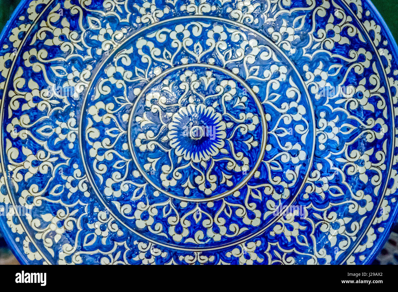 Ceramics with hand painted blue and white traditional uzbek patterns Stock Photo