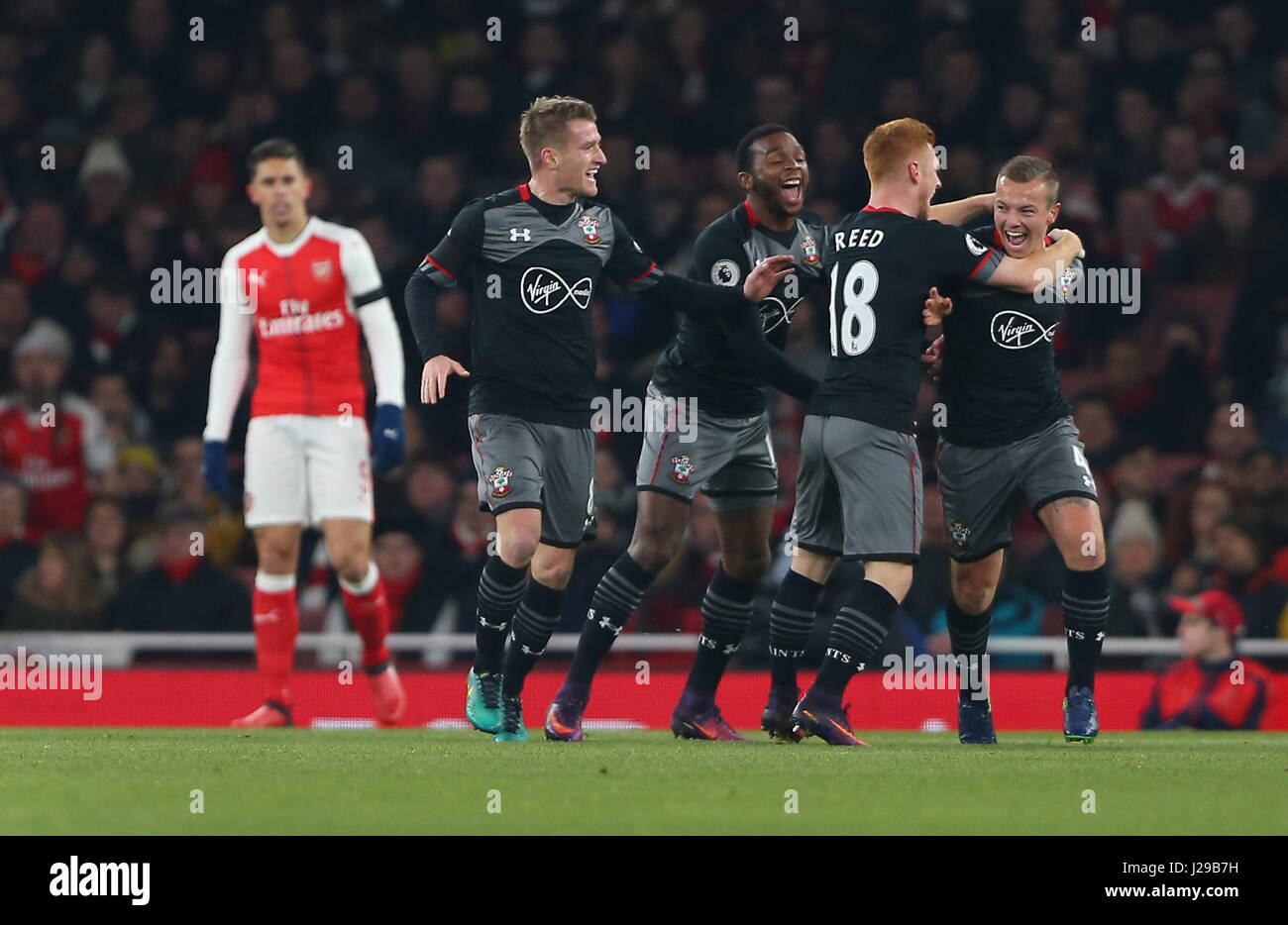 Jordy Clasie of Southampton (R)  celebrates after scoring  during the EFL Cup Quater-final match between Arsenal and Southampton at the Emirates Stadium in London. November 30, 2016. EDITORIAL USE ONLY - FA Premier League and Football League images are subject to DataCo Licence see www.football-dataco.com Stock Photo