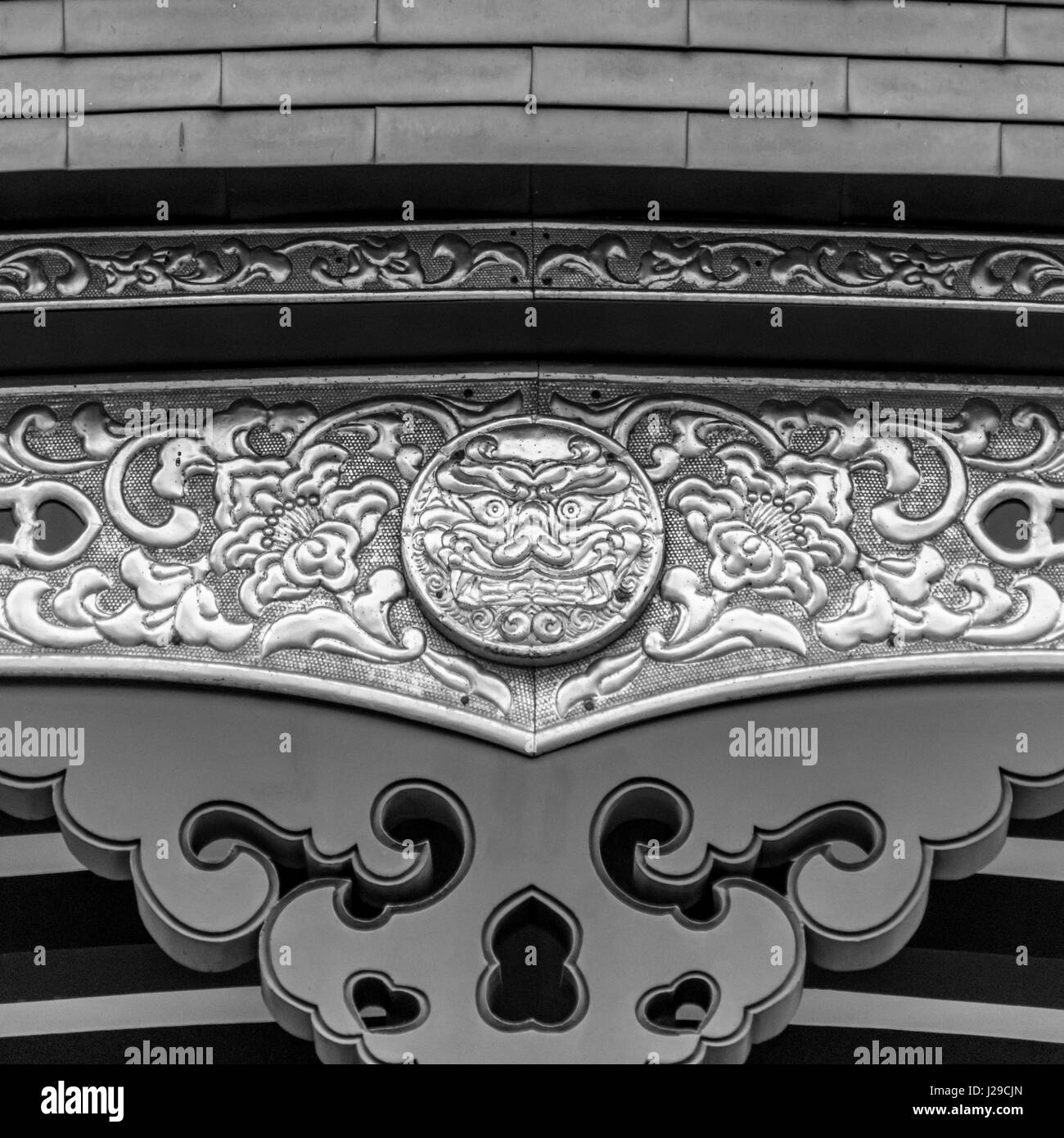 Detail of the beautiful Oni icon and ornaments in the roof of Haneda ...