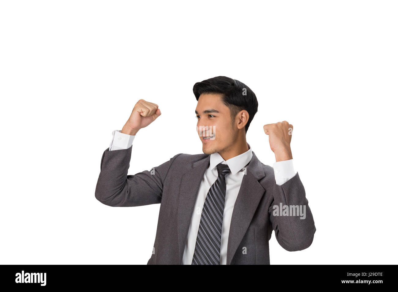 business, people, success, gladness and cheerful concept - young asian man startup entrepreneur businessman raise his hands with happiness on white ba Stock Photo