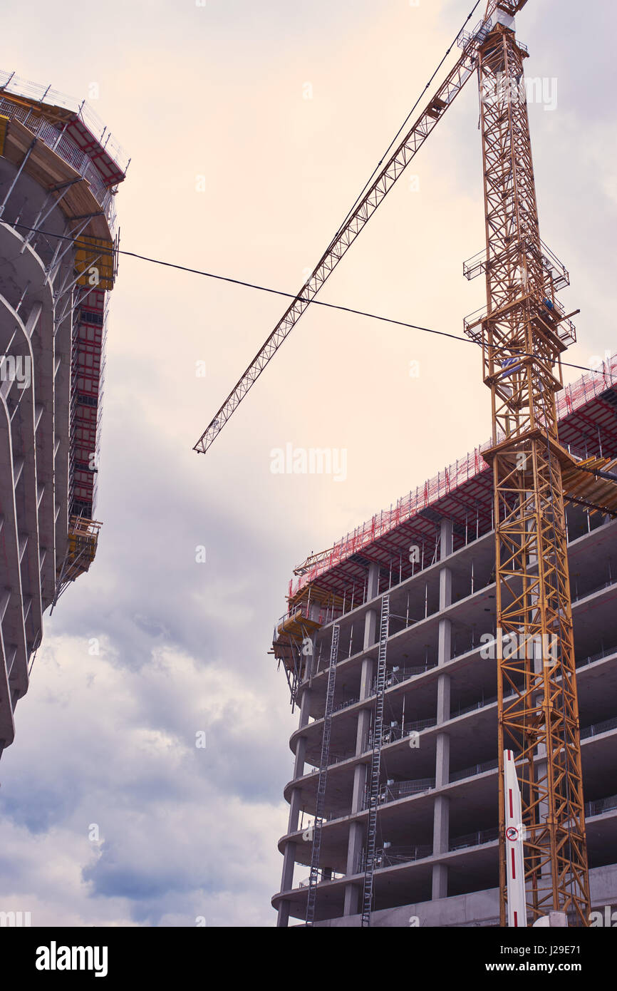 Modern housing development with cranes Stock Photo