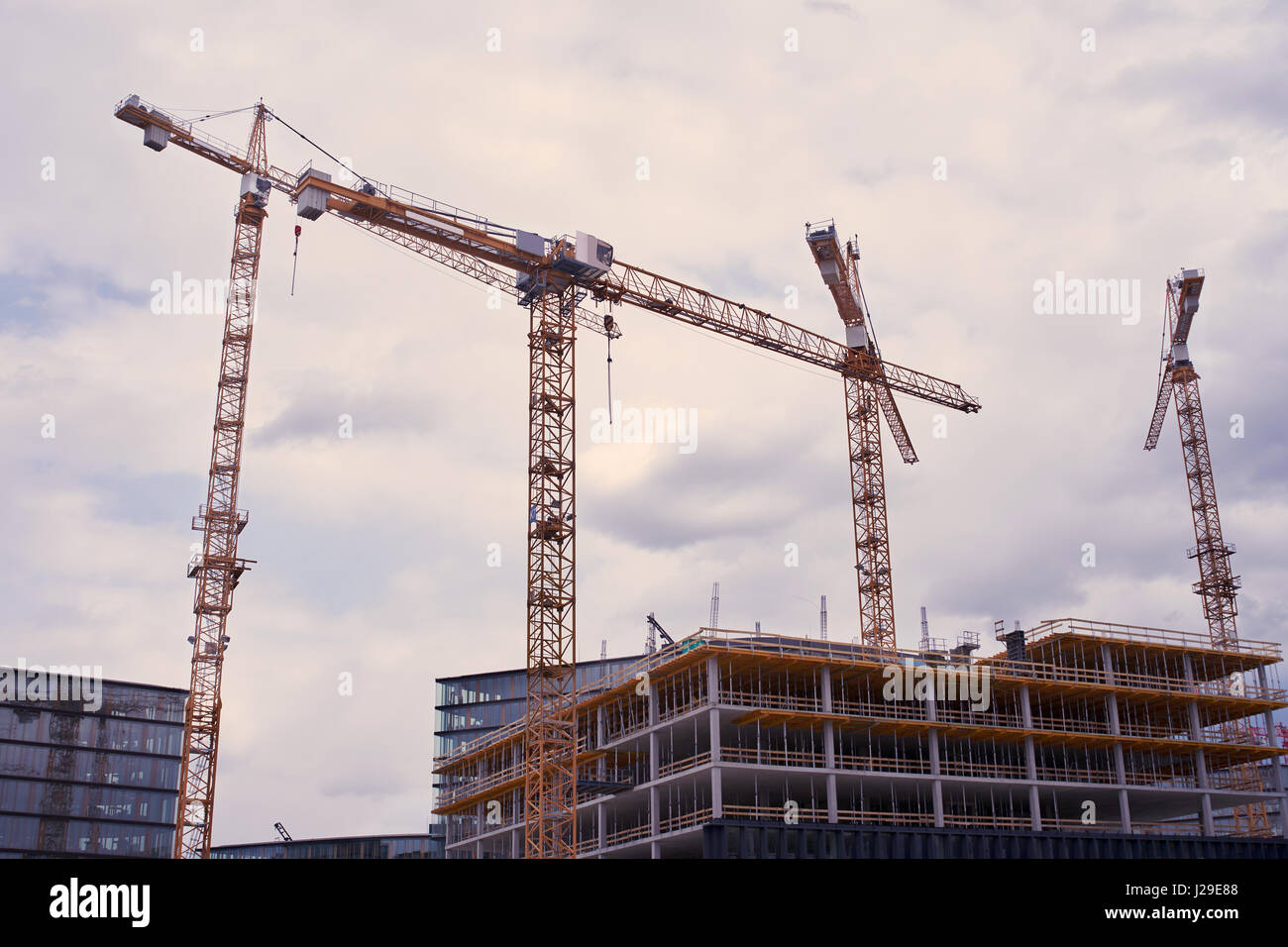 Modern housing development with cranes Stock Photo