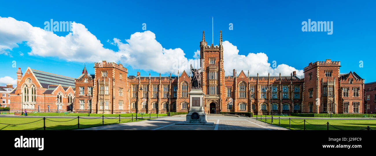 The Queen's University of Belfast with a grass lawn in senset light. Wide pamorama, Stock Photo