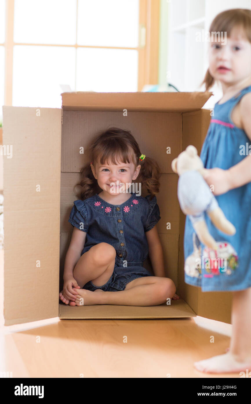 Child little girl inside box Stock Photo