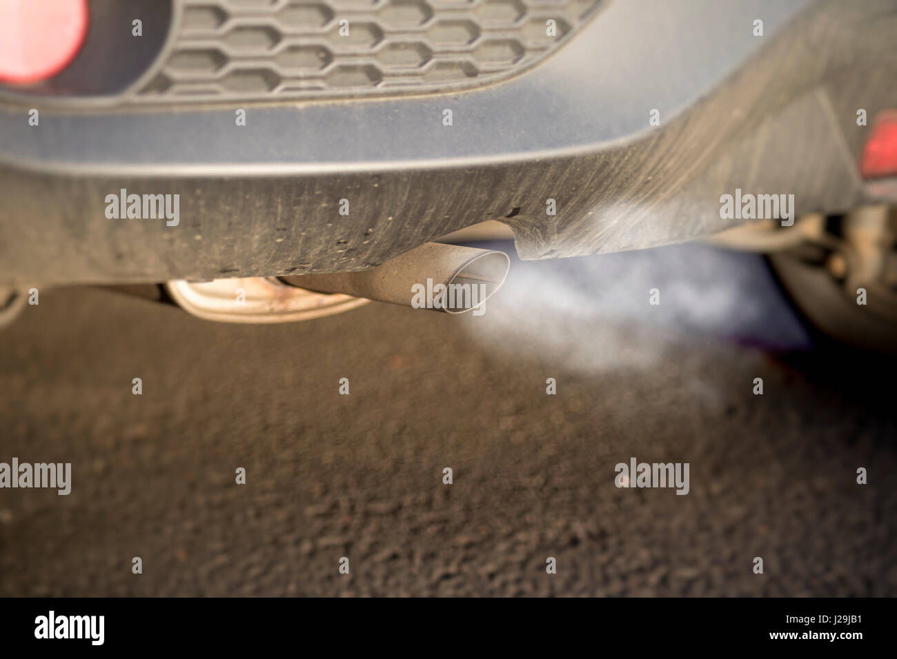 Car exhaust fumes causing health problems and environmental concerns Stock Photo