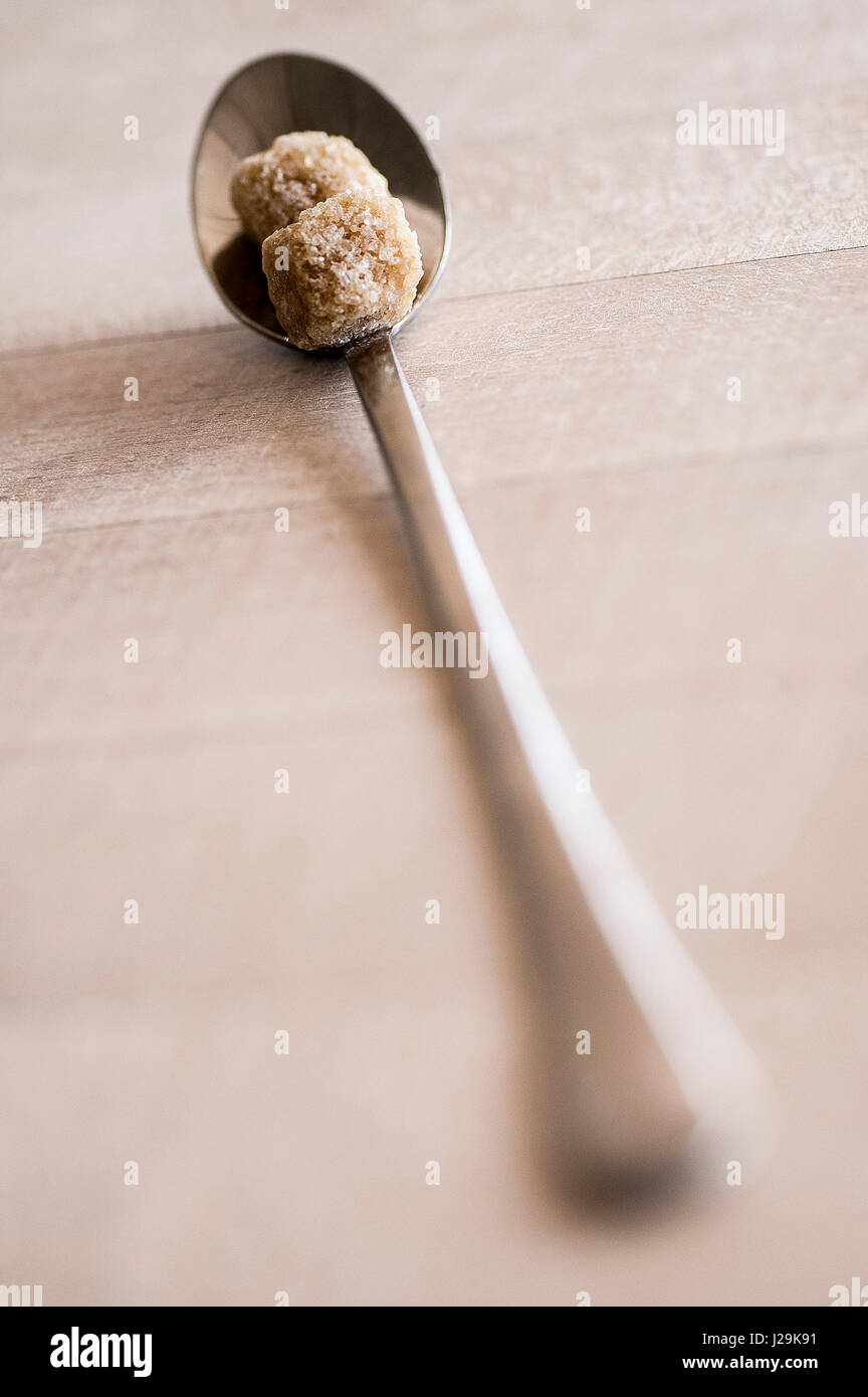 Close up view Sugar cubes Spoon Brown sugar Nobody Stock Photo