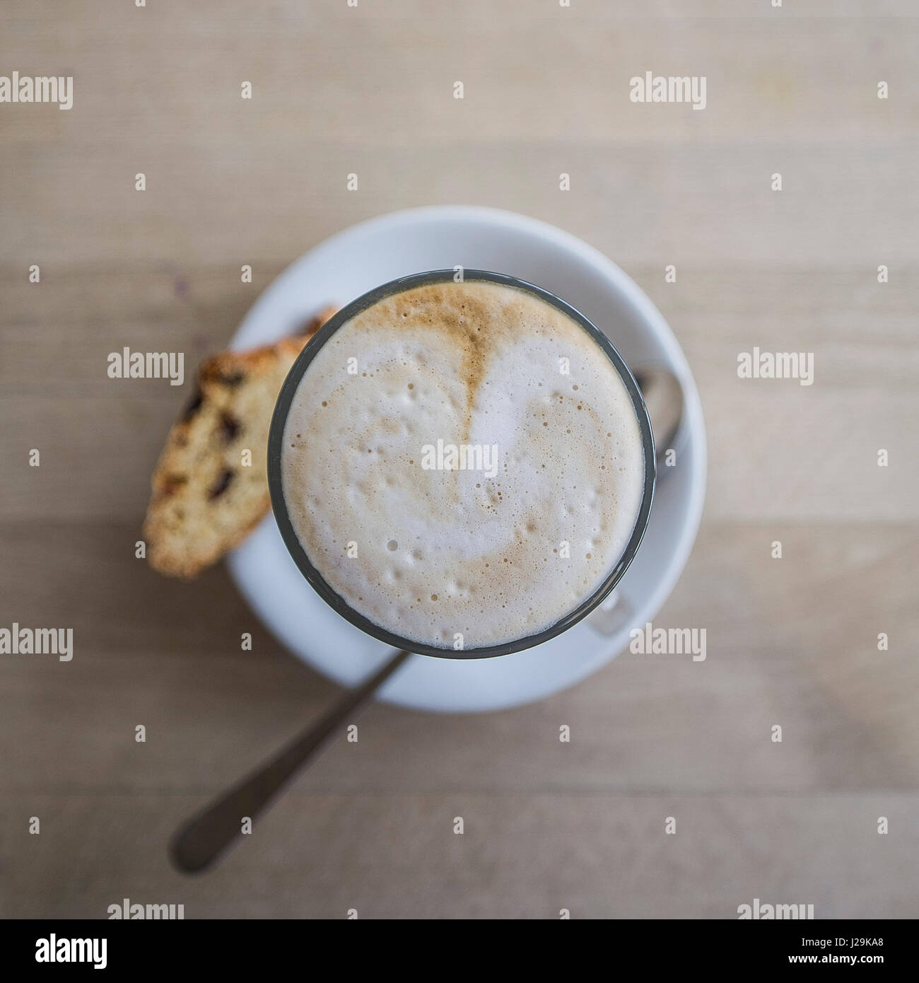 Latte coffee Closeup view Froth Biscotti biscuit Coffee break Refreshment Nobody Stock Photo