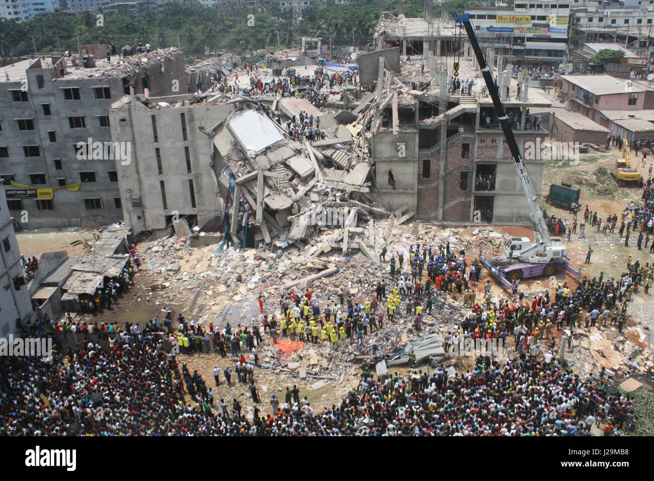 Savar Building Bangladeshis watch the rescue operations at the site of a building that ...