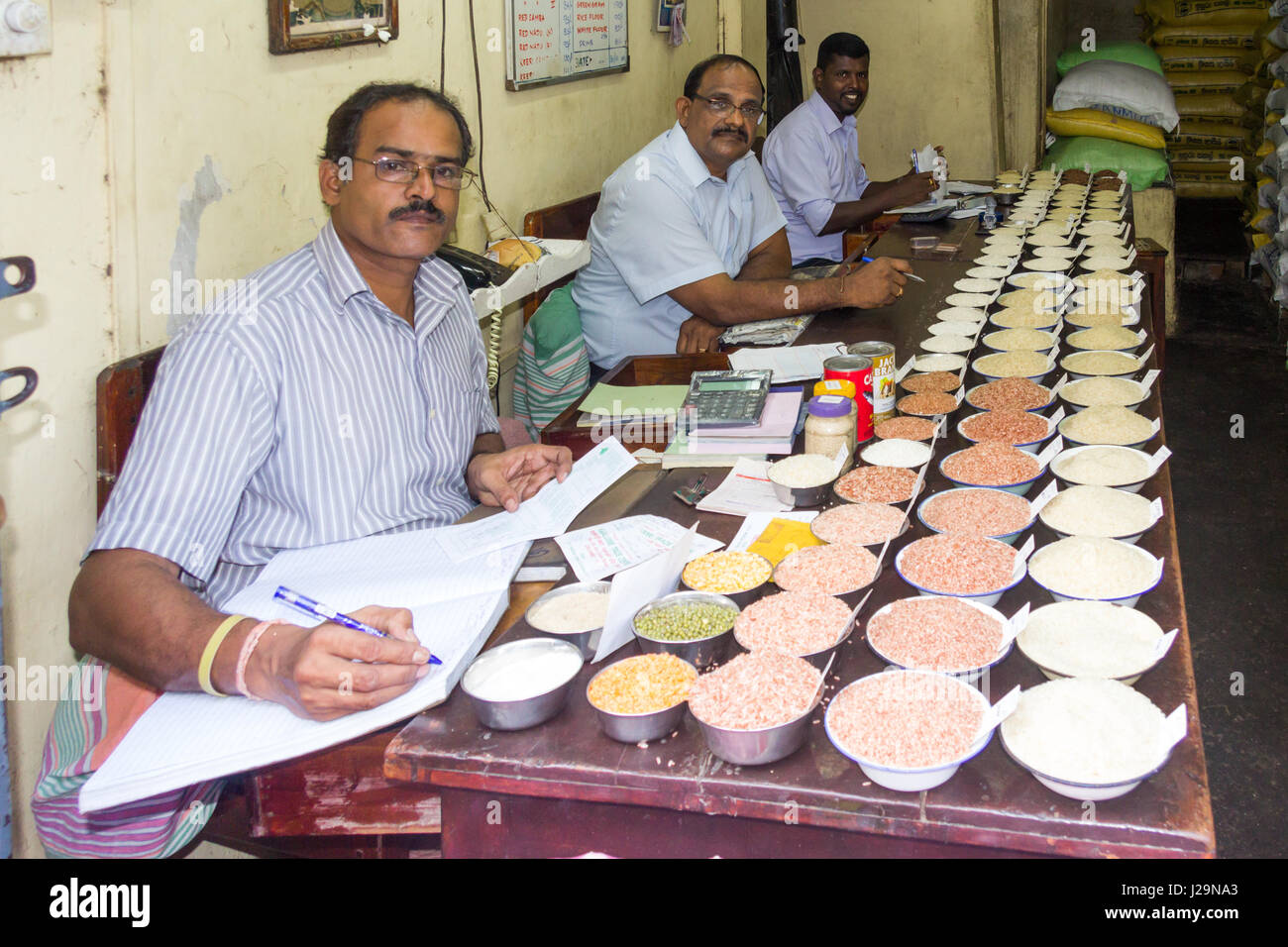 Rice traders at work in their office in Pettah district, Colombo, Sri Lanka Stock Photo