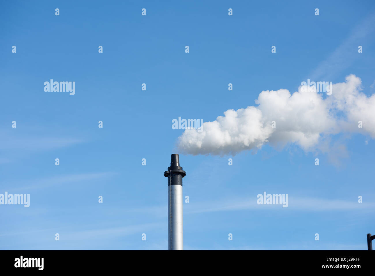 Smoky chimney Stock Photo