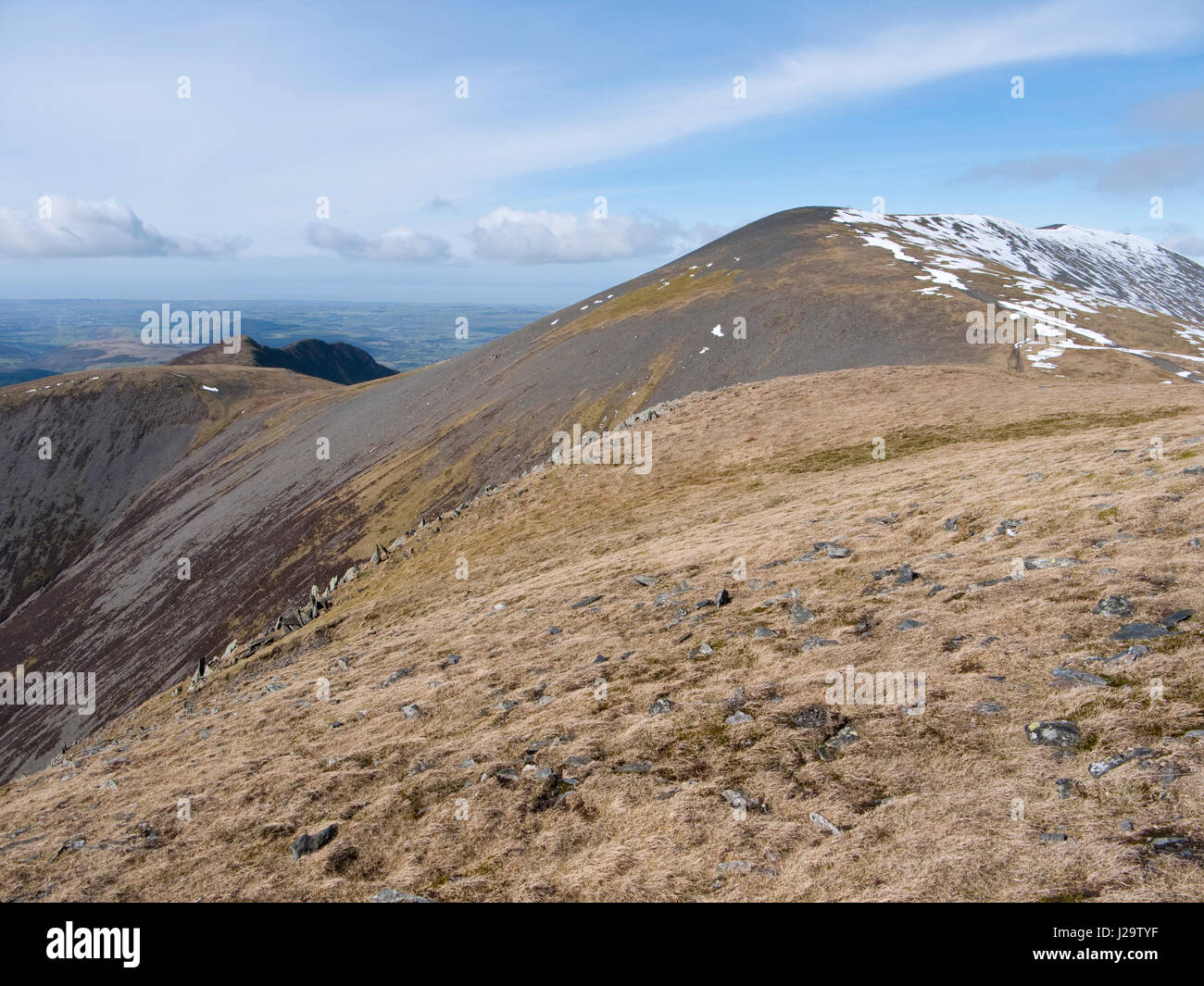 The summit of Skiddaw, a mountain in the English Lake District, viewed from the slopes of Little Man. Ullock Pike & Longside Edge visible on the left Stock Photo