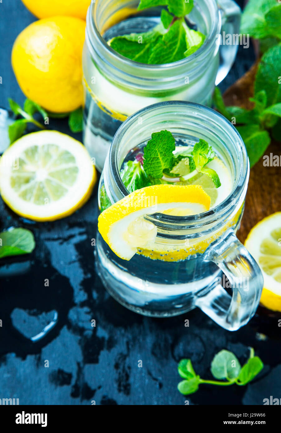 Lemon And Mint Infused Water Glasses Fresh Lemon Slices With Mint lemon-and-mint-infused-water-glasses-fresh-lemon-slices-with-mint
