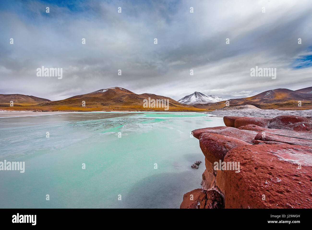 Chile lagoon called “Red Rocks” nearby San Pedro de Atacama is situated ...
