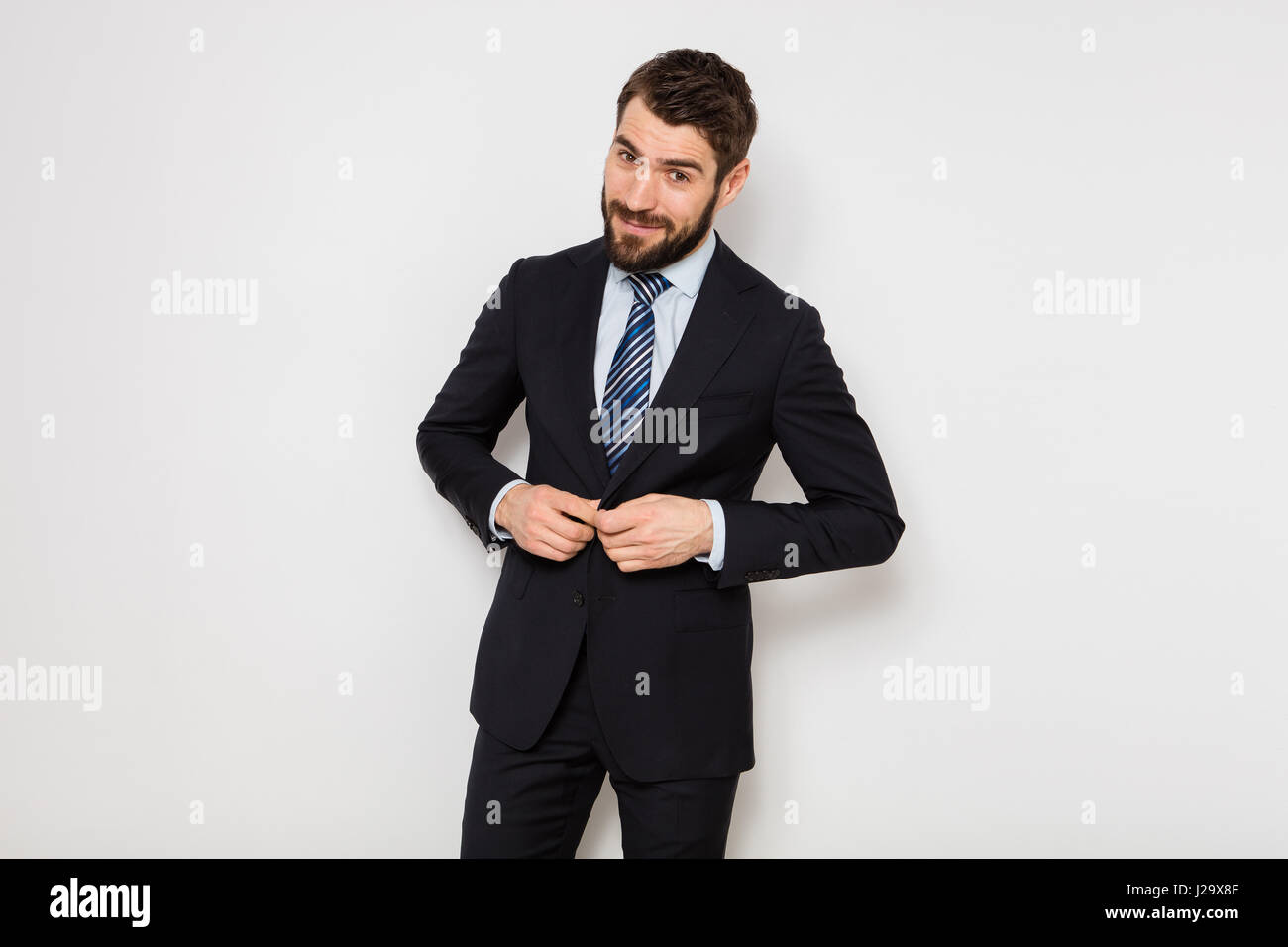 Confident man in suit hi-res stock photography and images - Alamy