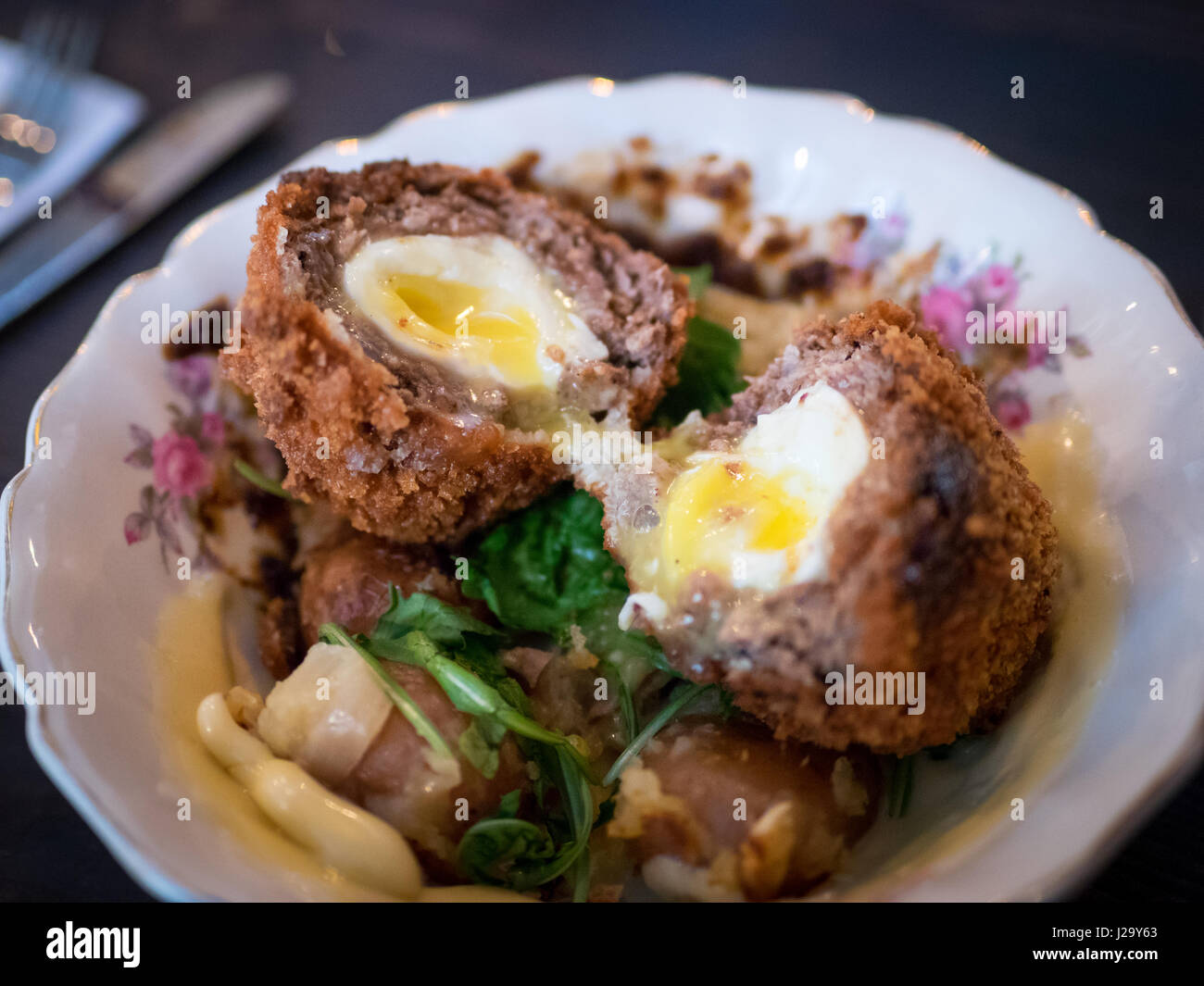 A Scotch egg for brunch at Chartier, a restaurant in Beaumont, Alberta, Canada. Stock Photo