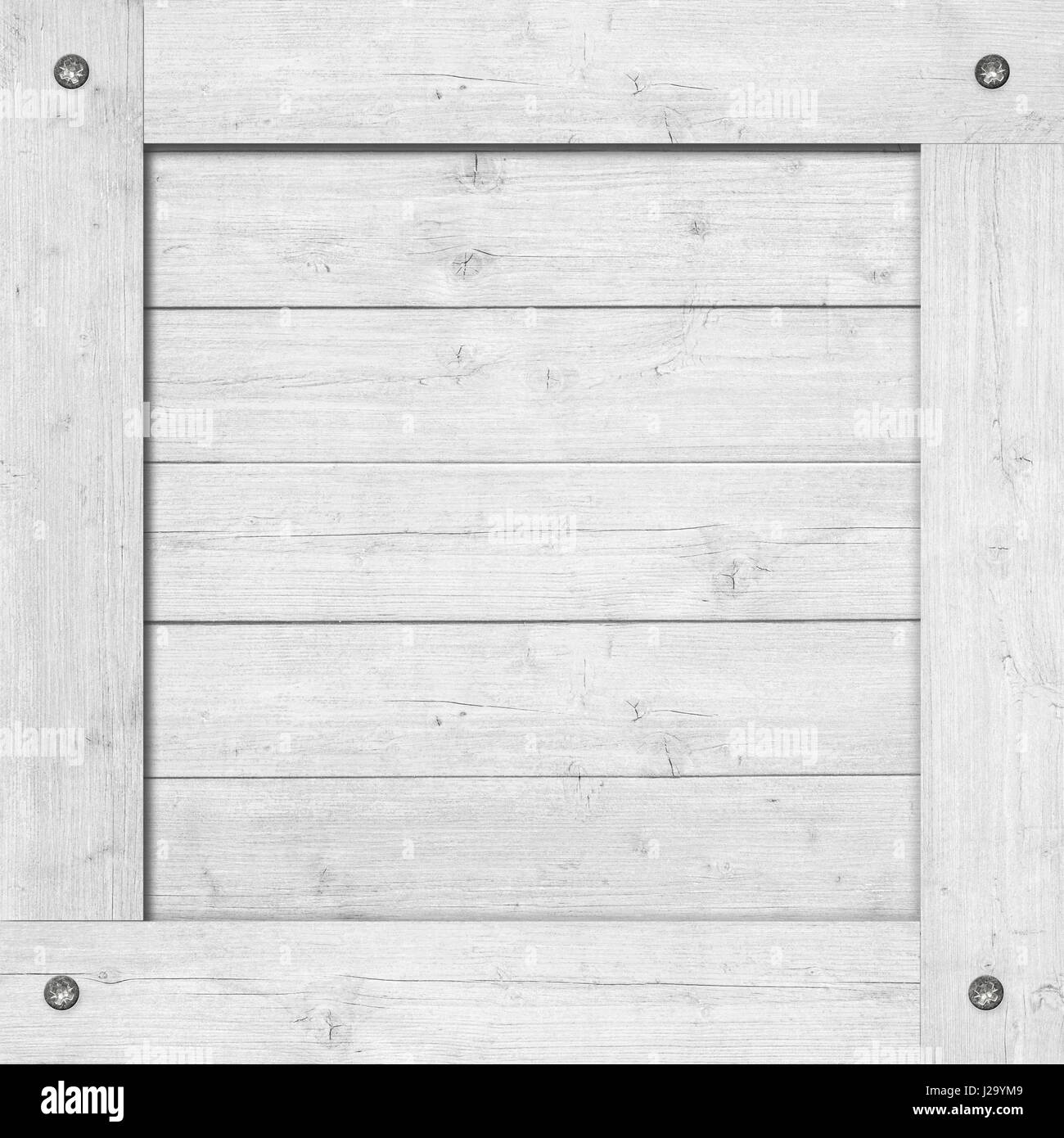 Side of white wooden crate, box, wall or frame with screws Stock Photo