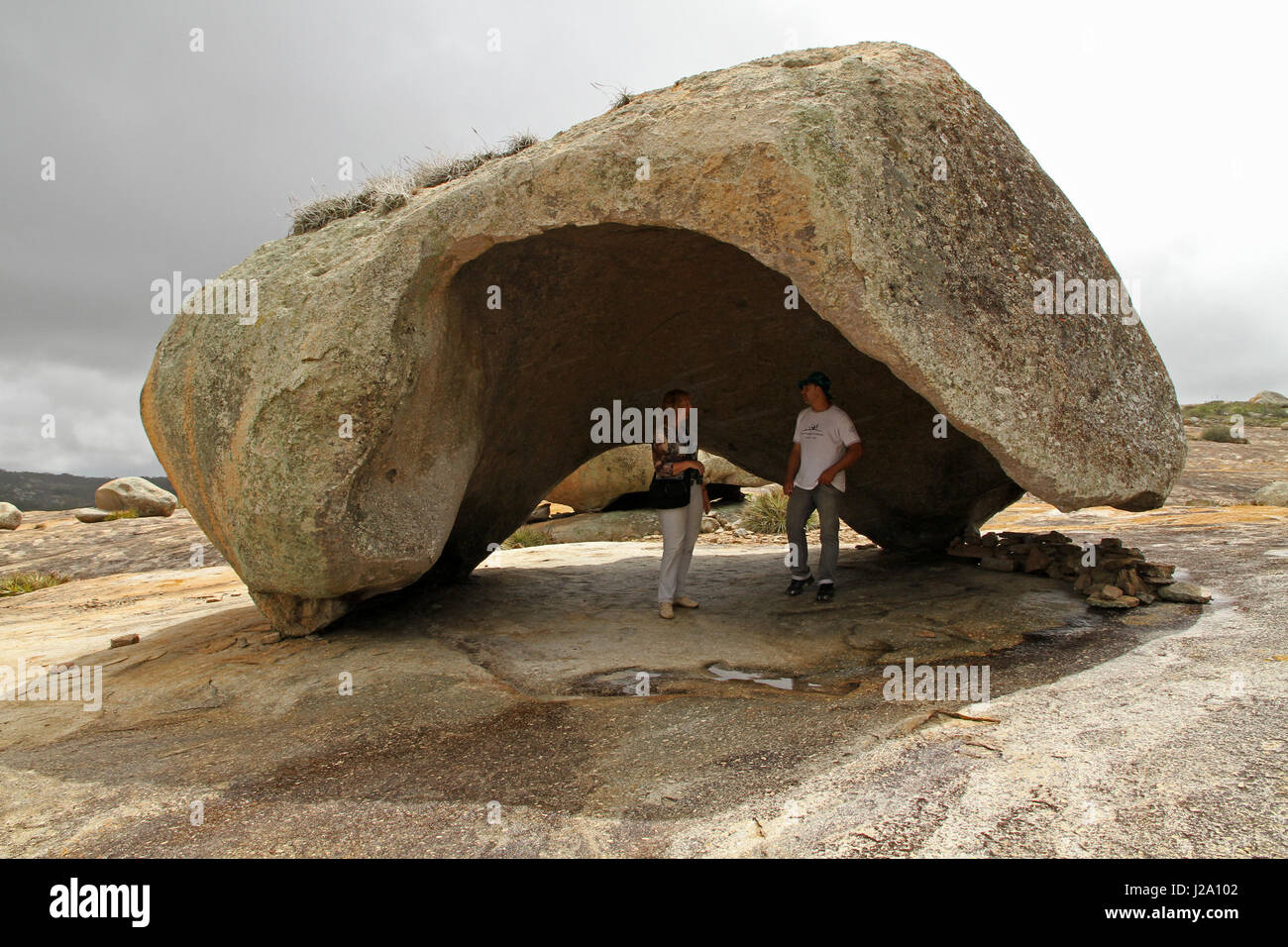giant hollowed out marble on rock slope Stock Photo