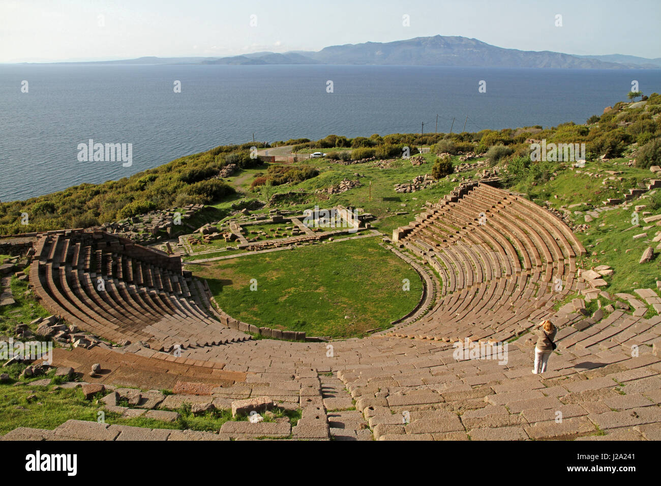 Assos theater with Lesbos in the background Stock Photo