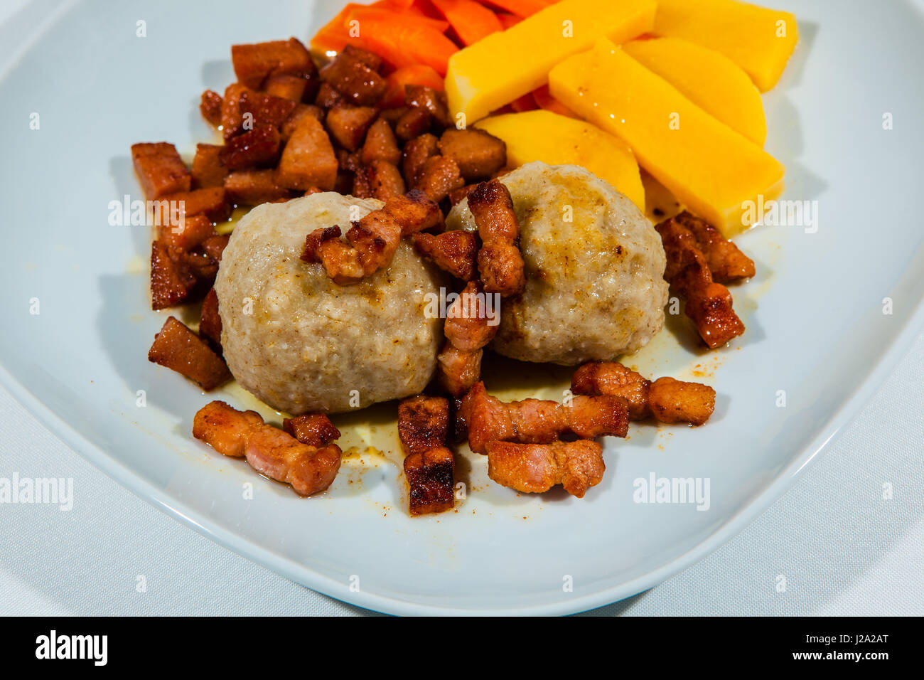 Potato dumplings, traditional Norwegian food with accessories such as