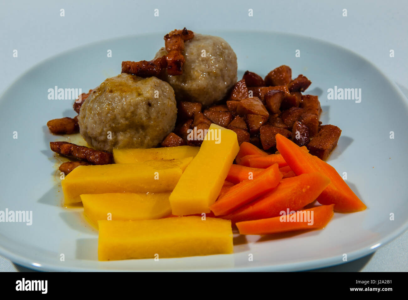 Potato dumplings, traditional Norwegian food with accessories such as