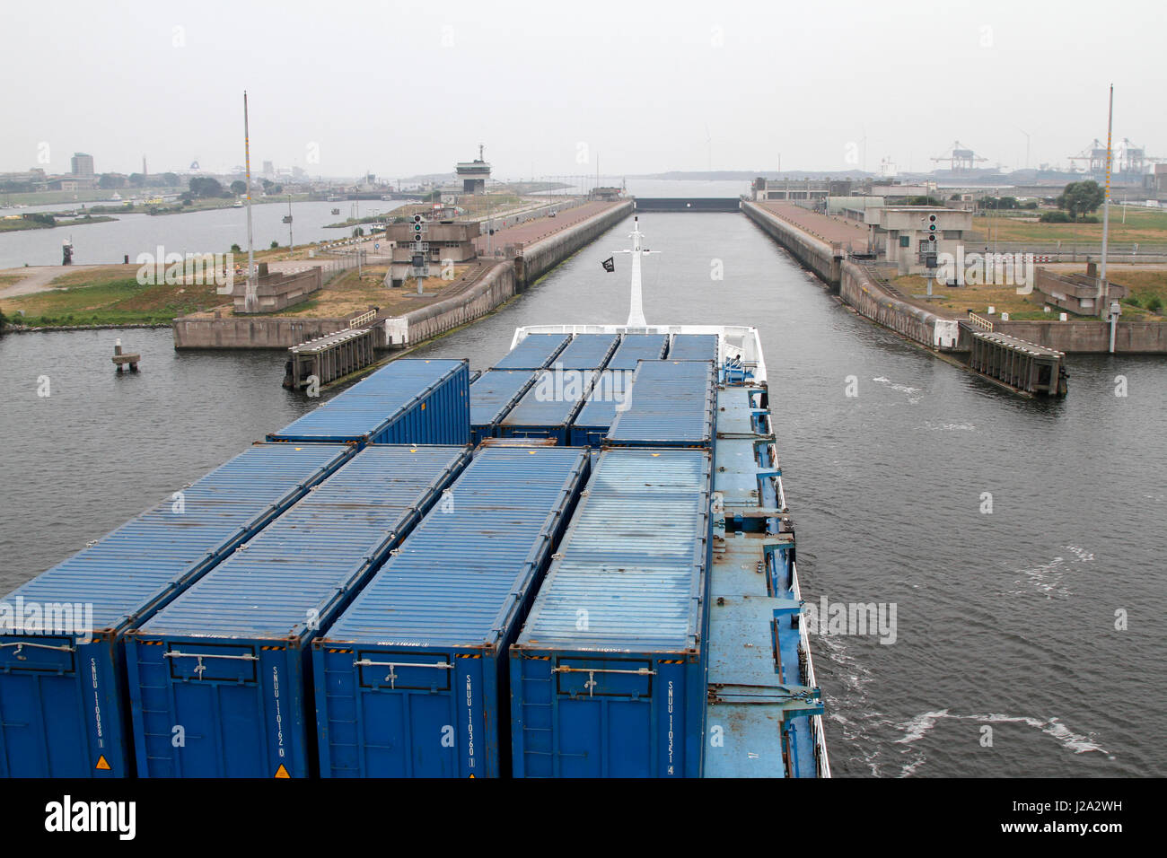container ship approaches the lock at IJmuiden Stock Photo Alamy