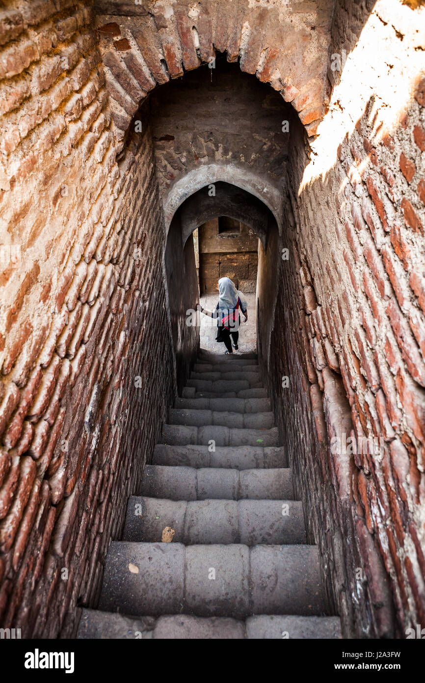 A woman at the bottom of a stairway in Shaniwar Wada Fort, Pune, Maharashtra,  India Stock Photo - Alamy