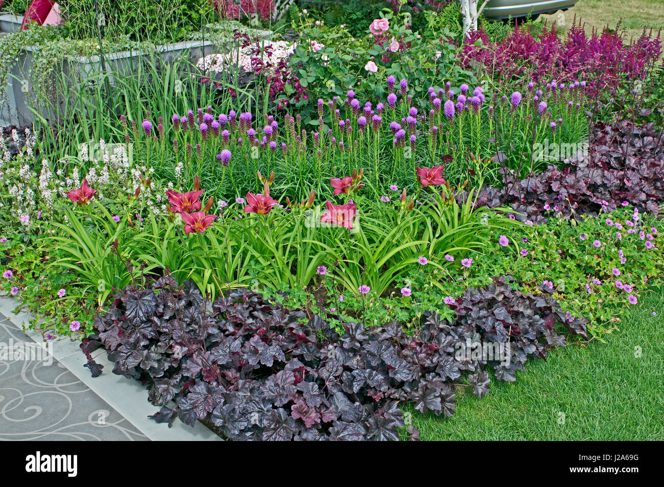 Flower border with daylilies and Liatris spicata 'Kobold' Stock Photo