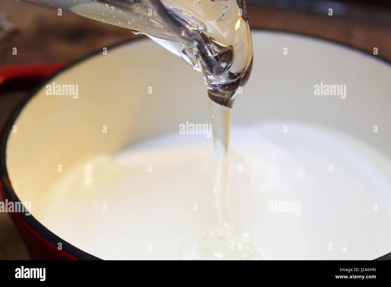 Pouring Clear Thick Liquid into a Pot Stock Photo Alamy