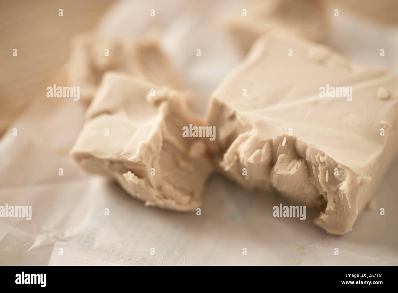 fresh yeast and flour on table closeup Stock Photo