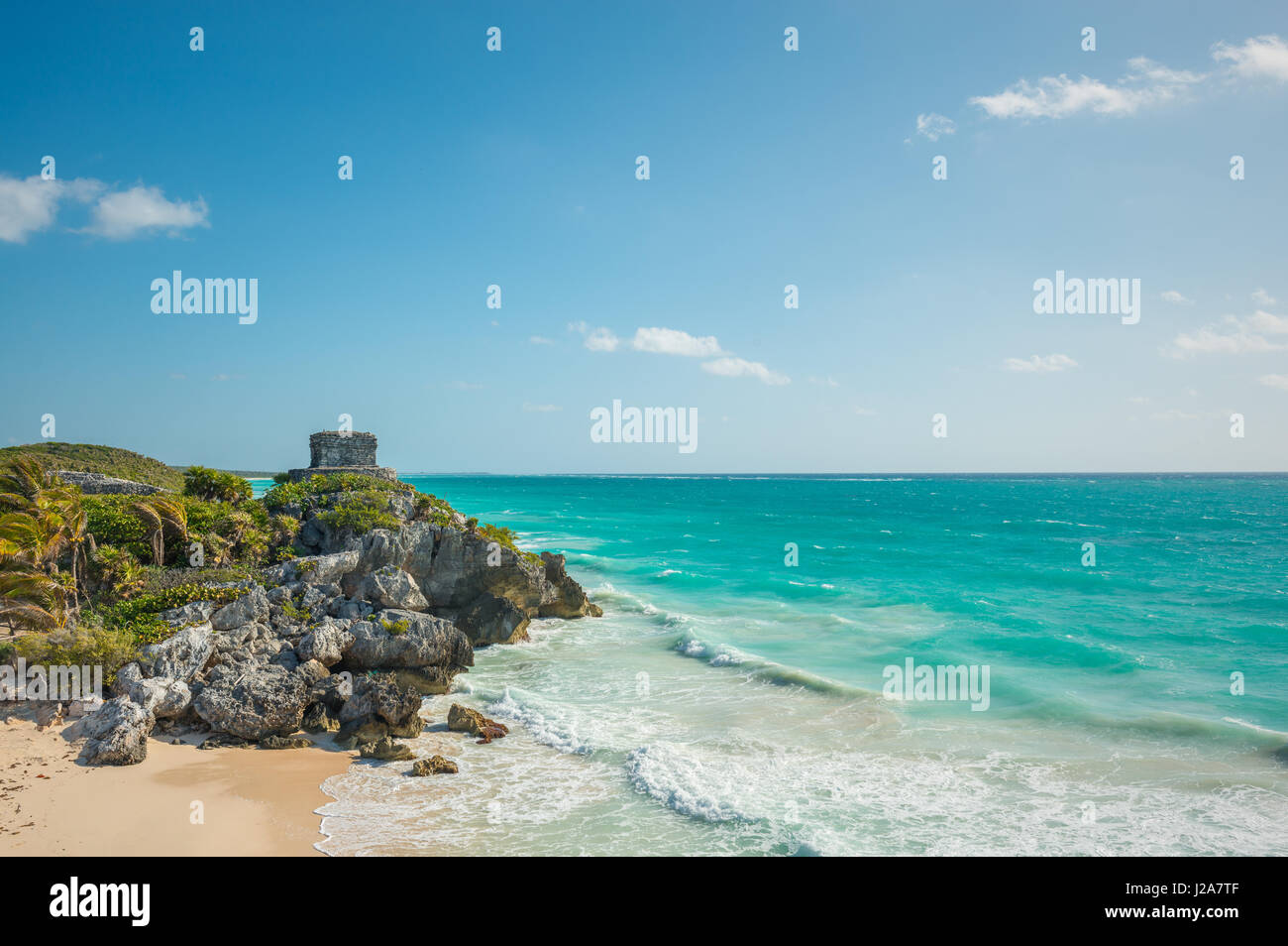 The Caribbean Sea with turquoise waters and white sand beach as a backdrop for the Tulum Maya ruins, Mexico. Stock Photo