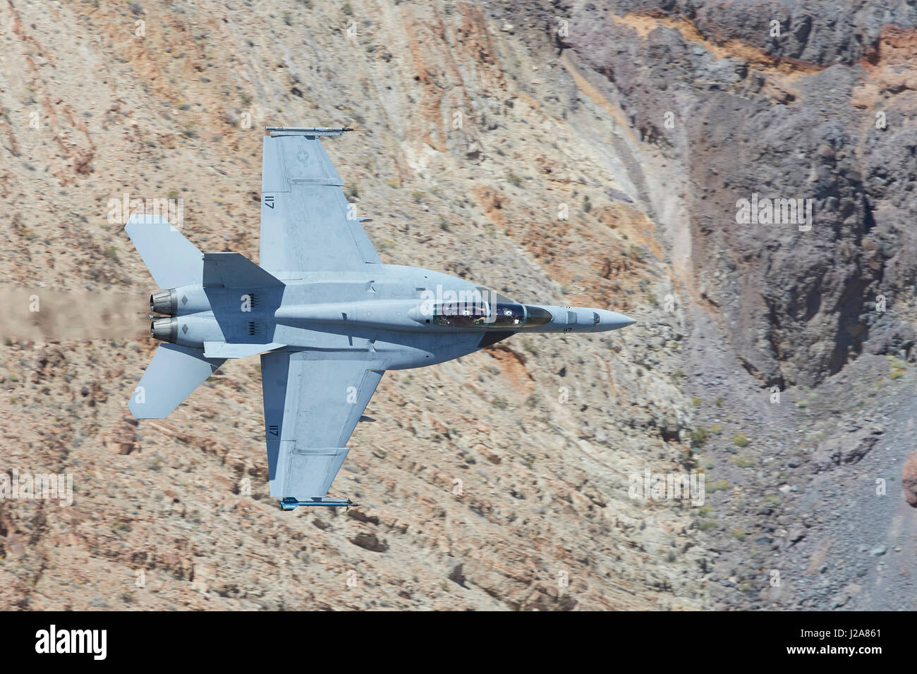 United States Navy F/A-18F, Super Hornet, Flying At High Speed And Low Level. Through A Desert Canyon. Stock Photo