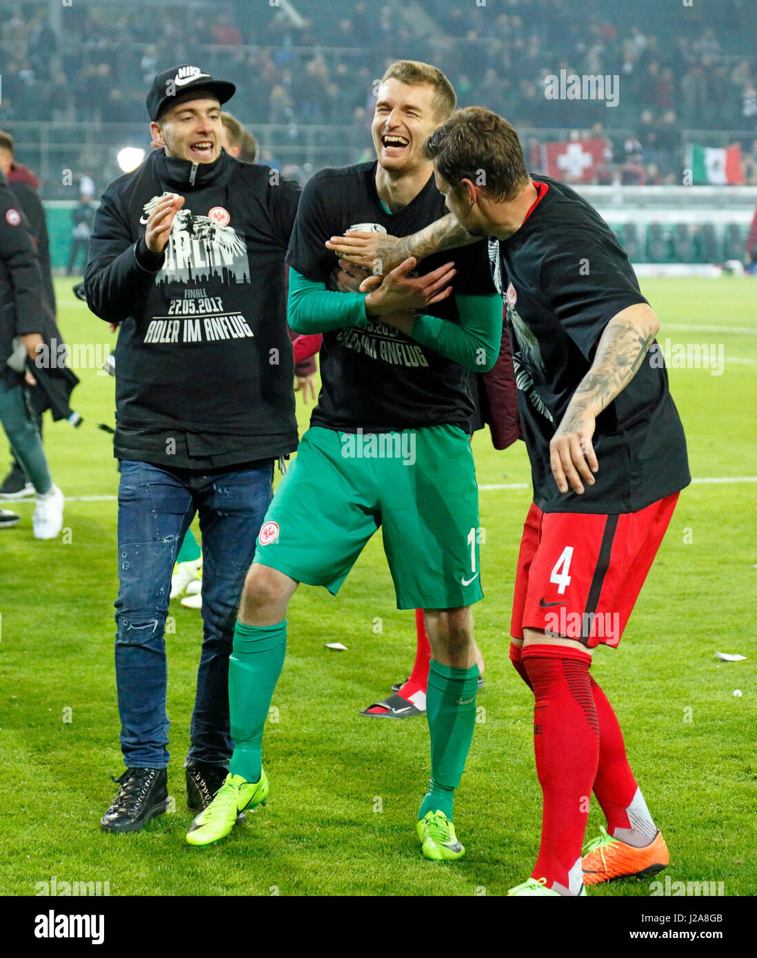 sports, football, DFB Cup, 2016/2017, Round 5, semifinal, Borussia Moenchengladbach vs Eintracht Frankfurt 7:8 on penalties, Stadium Borussia Park, Frankfurt players rejoicing at the win and the entry to the DFB Cup final 2017 in Berlin, keeper Lukas Hradecky (Frankfurt) and Marco Russ (Frankfurt) right Stock Photo